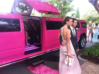School Ball Hummer Limousine seating 16 passengers in the Pink 2012 middle door jet door stretch Limo, only available in Perth. school ball limo photos taken with guests in CLaremont Western Australia before arriving at the Duxton Hotel